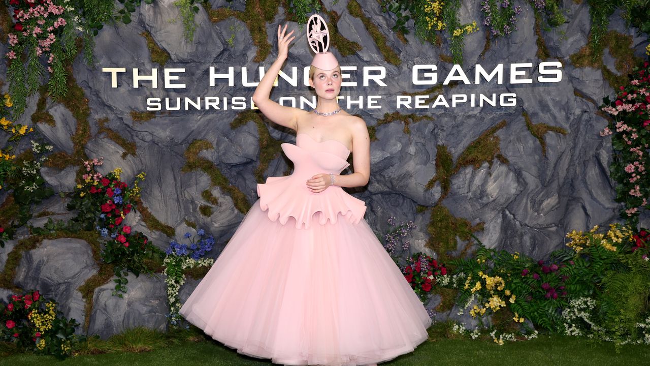 A tiny ballerina tops a pink fashion look